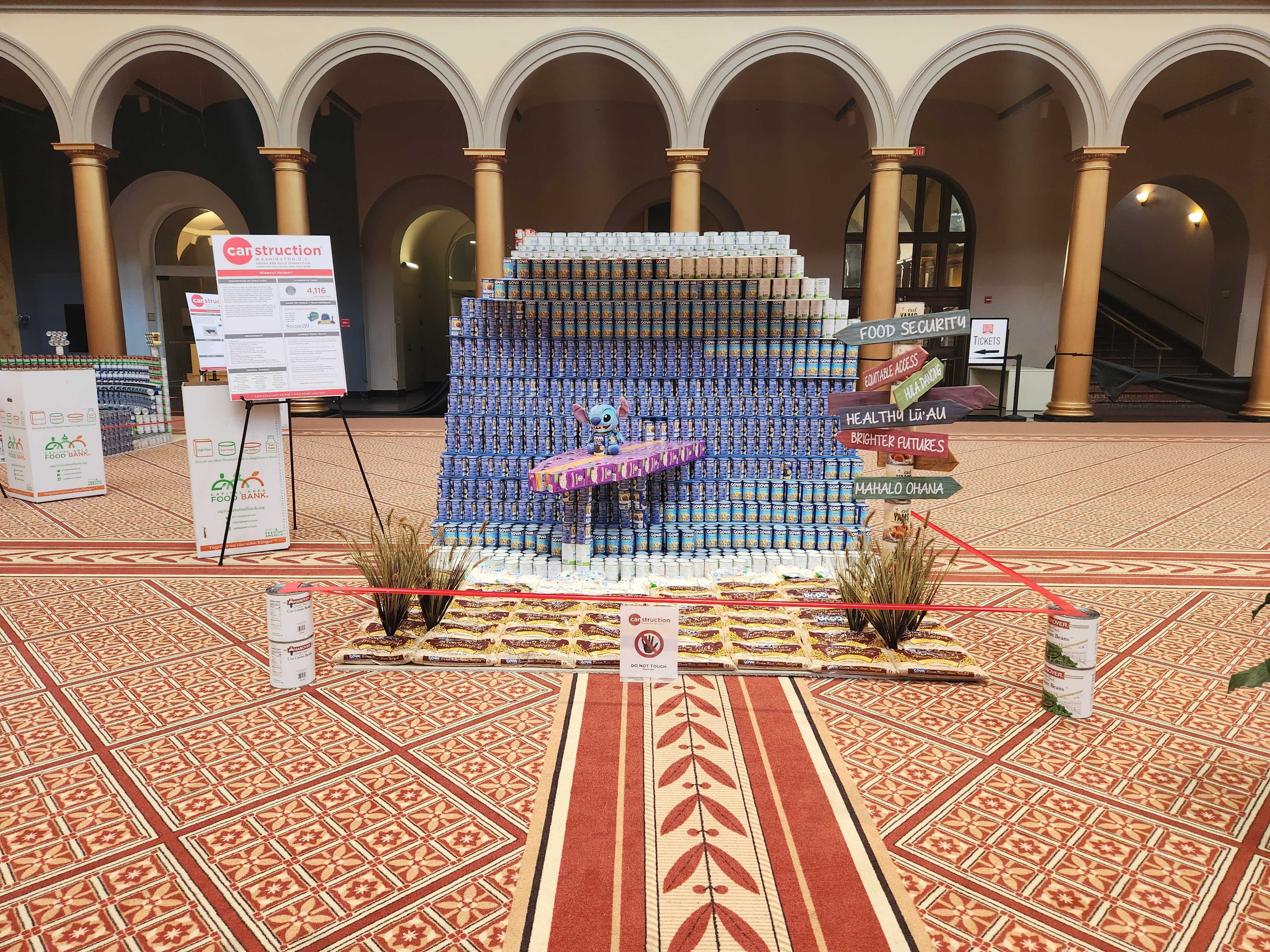 Image of canned food sculpture in shape of wave